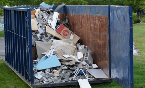 Front view of a commercial waste collection vehicle at a business address in Abbey Wood